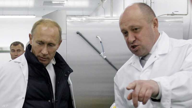 رجل الأعمال يفجيني بريجوجين و الرئيس الروسي فلاديمير بوتين 
