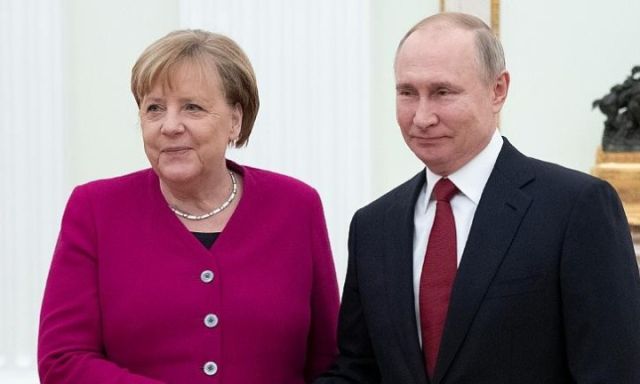 الرئيس الروسي و المستشارة الألمانية